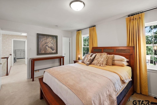 1701 Devonshire Dr, Tyler, TX 75703 - bedroom with light carpet and multiple windows
