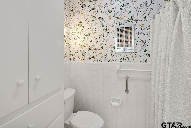 1701 Devonshire Dr, Tyler, TX 75703 - bathroom featuring wallpapered walls, a wainscoted wall, and tile walls