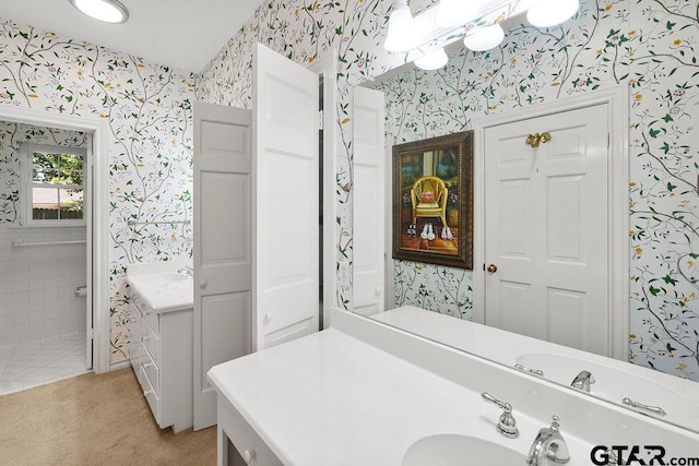 1701 Devonshire Dr, Tyler, TX 75703 - bathroom with wallpapered walls and vanity