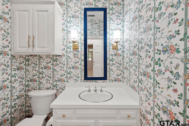 1701 Devonshire Dr, Tyler, TX 75703 - half bath featuring wallpapered walls and vanity
