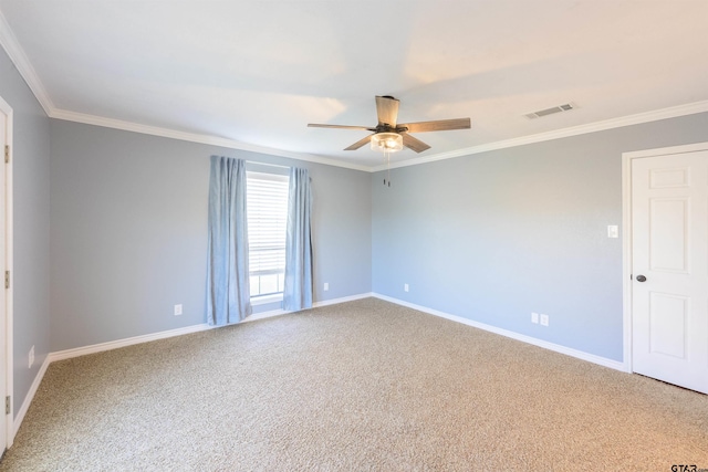spare room featuring visible vents, crown molding, carpet, and a ceiling fan