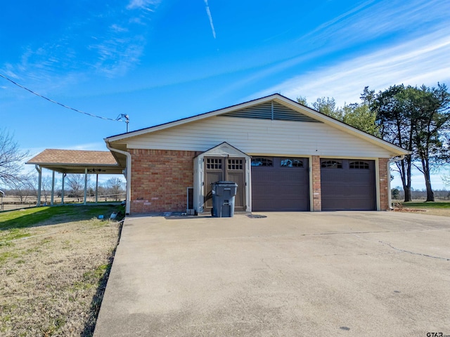 view of front of house with brick siding and a carport