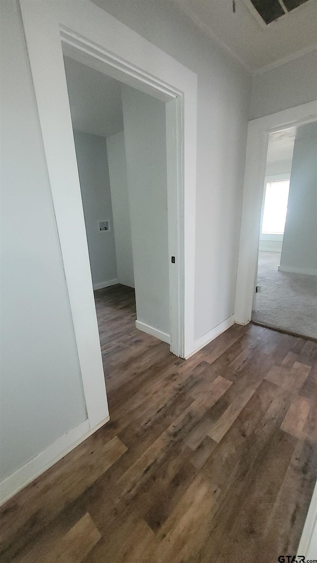 unfurnished room featuring baseboards, visible vents, and dark wood-style floors