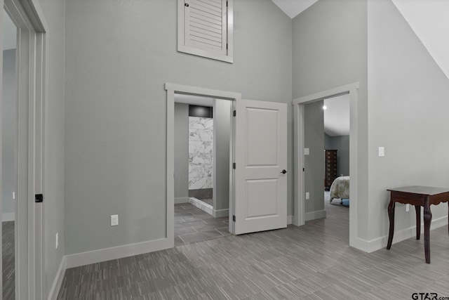 entrance foyer featuring light wood-type flooring and a high ceiling