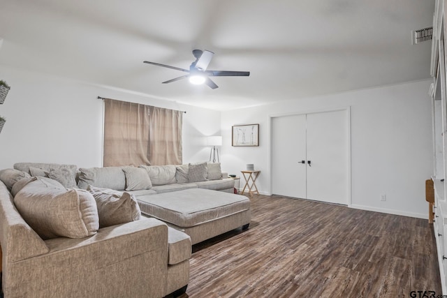 living room featuring ceiling fan and hardwood / wood-style floors