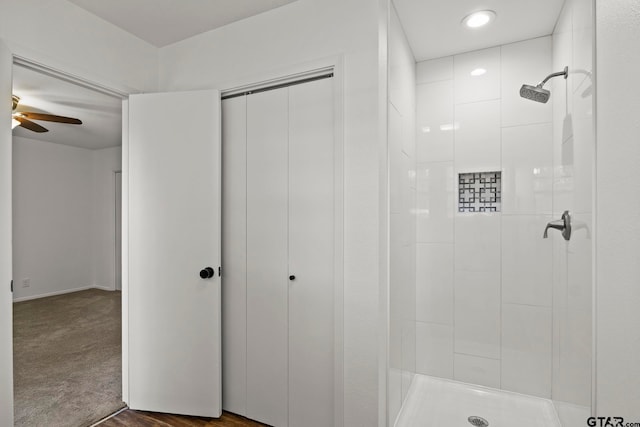 bathroom with a shower and ceiling fan