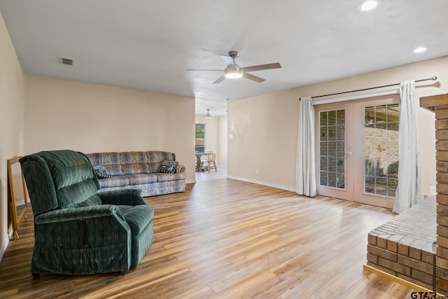 314 Cedar St, Mount Pleasant, TX 75455 - living room featuring wood finished floors, visible vents, a ceiling fan, french doors, and baseboards