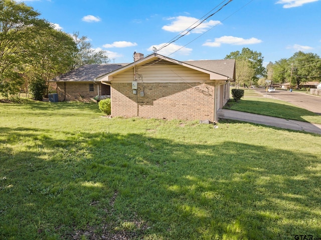 314 Cedar St, Mount Pleasant, TX 75455 - view of property exterior featuring brick siding and a yard