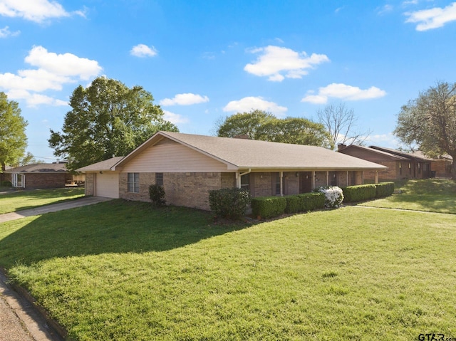314 Cedar St, Mount Pleasant, TX 75455 - view of side of home with brick siding, an attached garage, driveway, and a lawn
