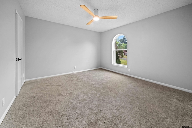 4715 Edinburgh Dr, Tyler, TX 75703 - carpeted empty room with ceiling fan, baseboards, and a textured ceiling