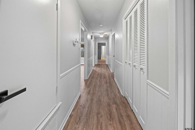 4715 Edinburgh Dr, Tyler, TX 75703 - hall featuring dark wood-type flooring and a textured ceiling