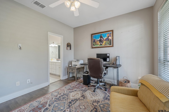 office area with light hardwood / wood-style flooring and ceiling fan