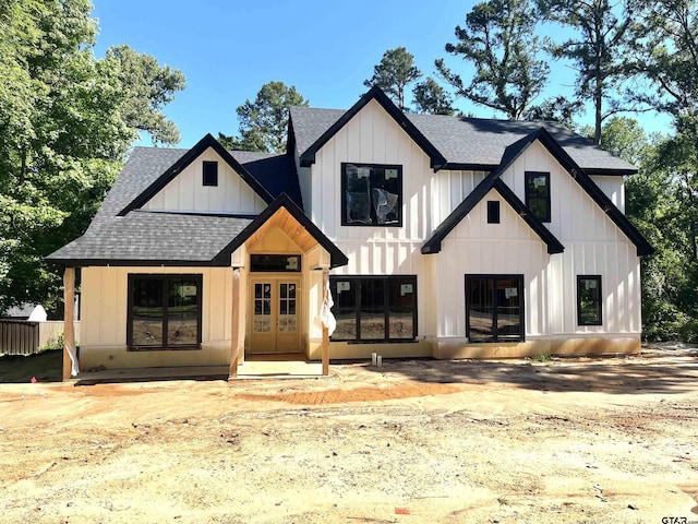 4020 Hanover Pl, Tyler, TX 75701 - modern farmhouse with a shingled roof, french doors, and board and batten siding