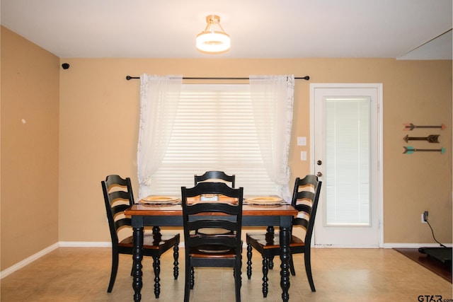 dining space with baseboards