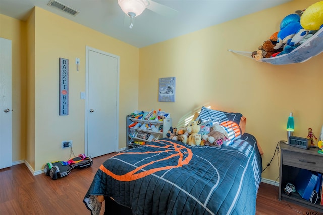 bedroom featuring hardwood / wood-style floors and ceiling fan