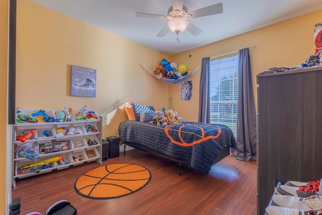 bedroom featuring hardwood / wood-style flooring and ceiling fan