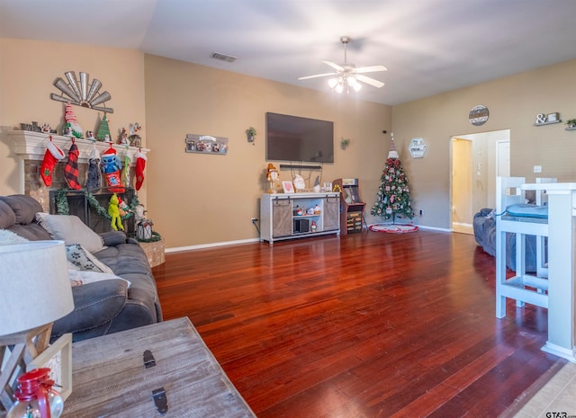 living room with hardwood / wood-style floors and ceiling fan