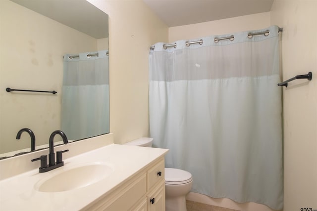 full bathroom with toilet, tile patterned floors, vanity, and a shower with shower curtain