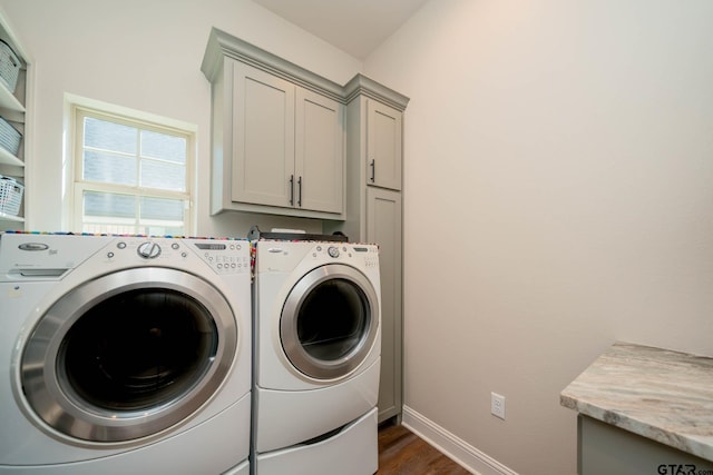 4523 Lone Oak Ln, Longview, TX 75605 - laundry area featuring cabinet space, washing machine and dryer, and dark wood-style floors