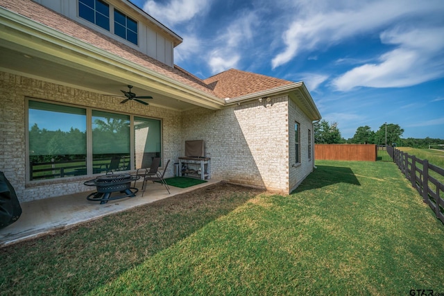 4523 Lone Oak Ln, Longview, TX 75605 - rear view of property with ceiling fan, a patio, a fenced backyard, brick siding, and roof with shingles