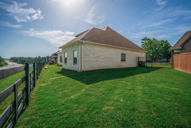 4523 Lone Oak Ln, Longview, TX 75605 - view of property exterior featuring a fenced backyard, brick siding, and a shingled roof