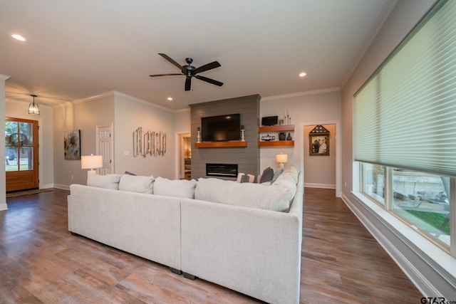 4523 Lone Oak Ln, Longview, TX 75605 - living area featuring a fireplace, ornamental molding, wood finished floors, a ceiling fan, and recessed lighting
