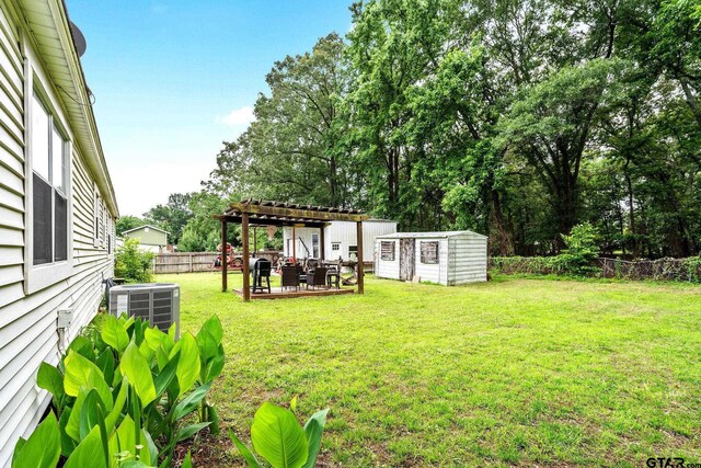 902 S Florey, Mount Pleasant, TX 75455 - view of yard with central AC and a pergola