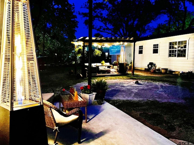 902 S Florey, Mount Pleasant, TX 75455 - patio at night featuring a patio and a pergola