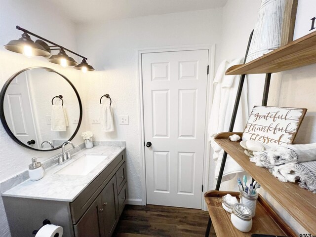 902 S Florey, Mount Pleasant, TX 75455 - bathroom featuring wood finished floors and vanity