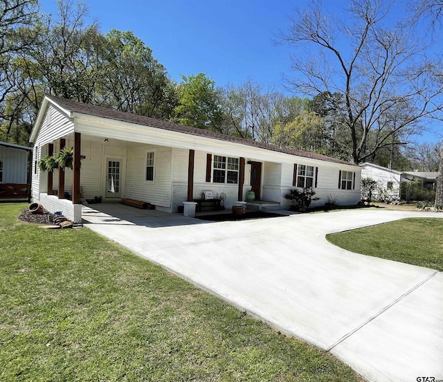 902 S Florey, Mount Pleasant, TX 75455 - single story home with concrete driveway, a front lawn, and an attached carport