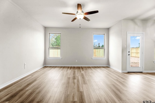 unfurnished room with ceiling fan and light hardwood / wood-style flooring