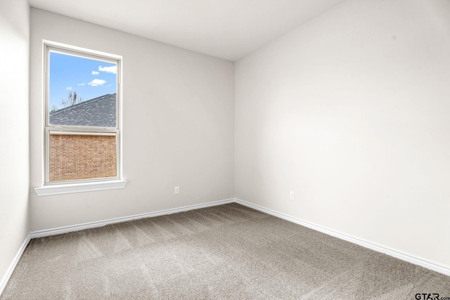 empty room with carpet flooring