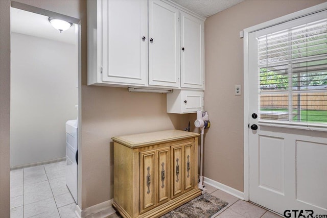 2733 Rockbridge Rd, Tyler, TX 75701 - doorway to outside with light tile patterned floors and washer / dryer
