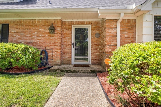 2733 Rockbridge Rd, Tyler, TX 75701 - property entrance with a shingled roof and brick siding