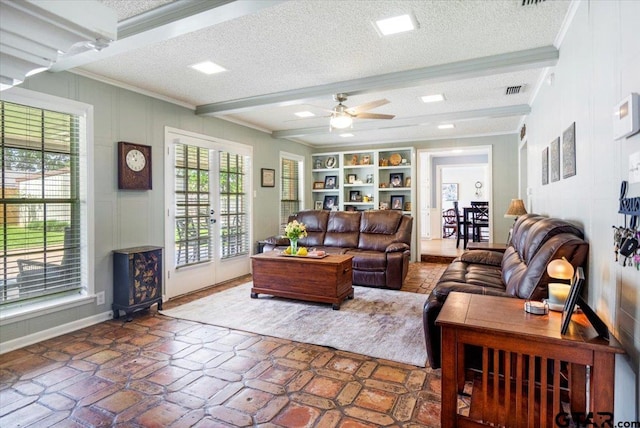 2733 Rockbridge Rd, Tyler, TX 75701 - living room with french doors, ornamental molding, a textured ceiling, ceiling fan, and beam ceiling