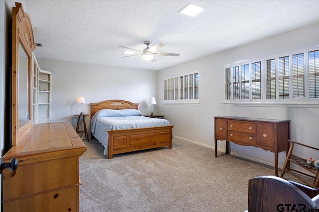 2733 Rockbridge Rd, Tyler, TX 75701 - bedroom featuring light colored carpet, a textured ceiling, and a ceiling fan