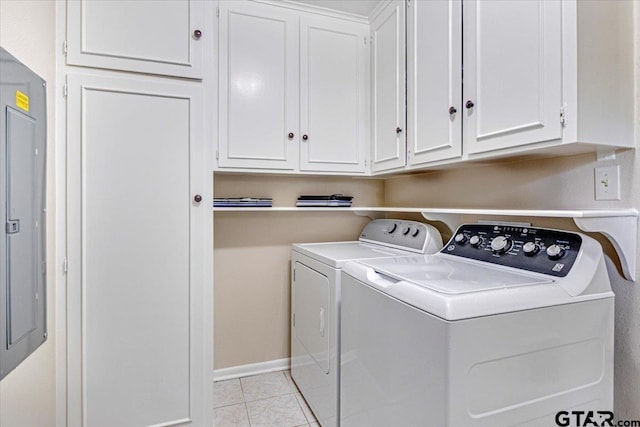 2733 Rockbridge Rd, Tyler, TX 75701 - laundry area featuring cabinet space, washer and dryer, light tile patterned floors, and electric panel