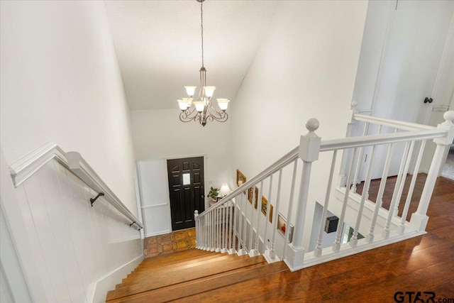 2733 Rockbridge Rd, Tyler, TX 75701 - stairs featuring a chandelier, wood finished floors, and high vaulted ceiling
