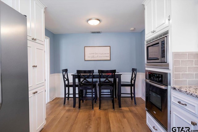 2733 Rockbridge Rd, Tyler, TX 75701 - dining area with light wood-type flooring