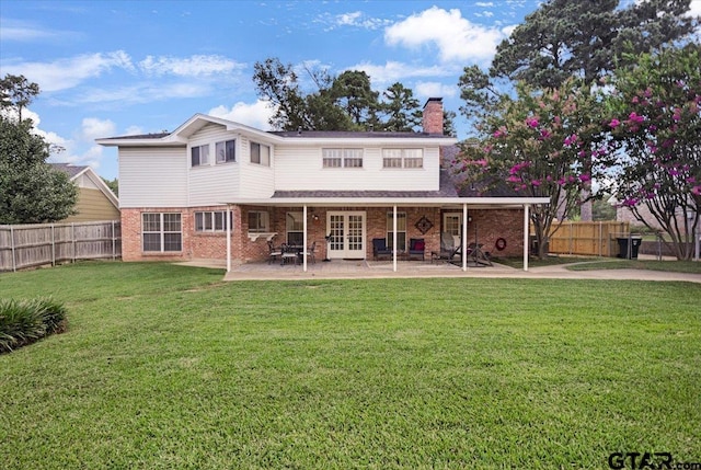 2733 Rockbridge Rd, Tyler, TX 75701 - rear view of property with french doors, a chimney, brick siding, and a patio area