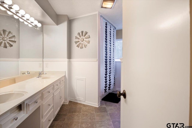 2733 Rockbridge Rd, Tyler, TX 75701 - full bathroom with double vanity and a textured ceiling