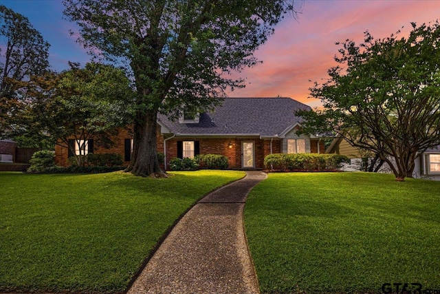 2733 Rockbridge Rd, Tyler, TX 75701 - view of front of home with brick siding and a yard