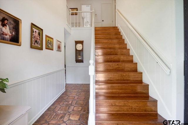 2733 Rockbridge Rd, Tyler, TX 75701 - stairway with a decorative wall and wainscoting