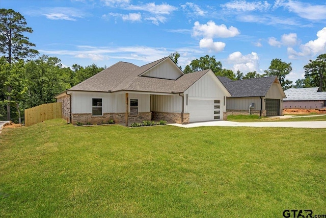 2099 Jackie Ave, Tyler, TX 75703 - modern farmhouse style home featuring driveway, a garage, roof with shingles, brick siding, and board and batten siding