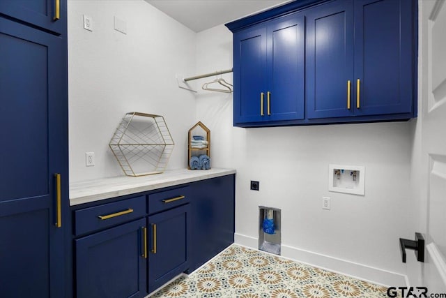2099 Jackie Ave, Tyler, TX 75703 - laundry room featuring cabinet space, hookup for a washing machine, tile patterned flooring, and electric dryer hookup