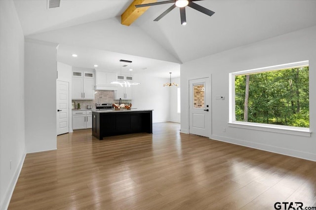 2099 Jackie Ave, Tyler, TX 75703 - living room with ceiling fan, beamed ceiling, wood finished floors, a chandelier, and recessed lighting