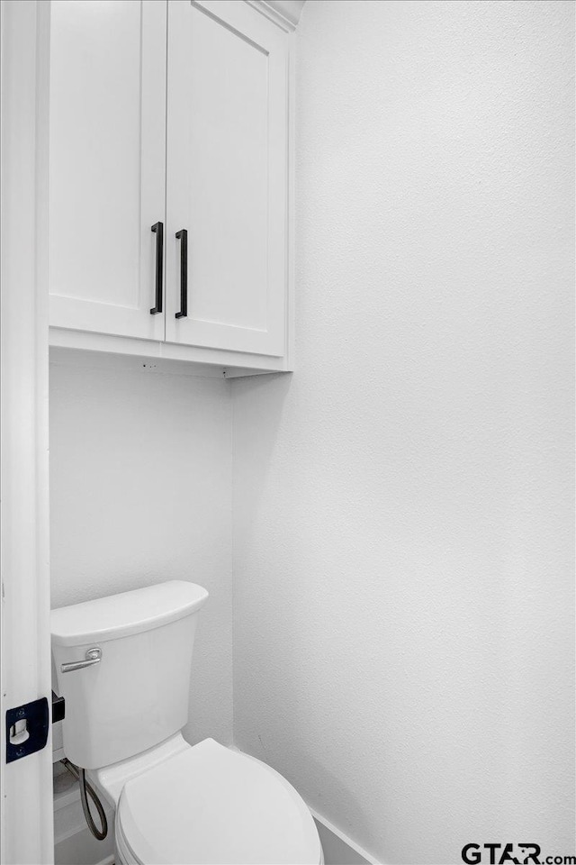 2099 Jackie Ave, Tyler, TX 75703 - bathroom featuring toilet and baseboards