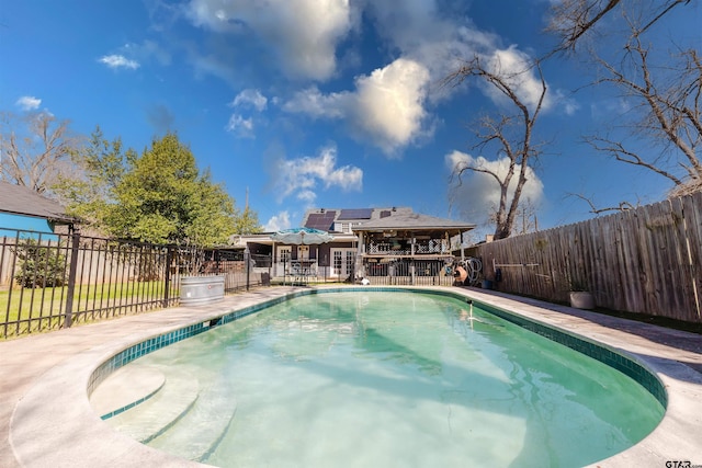 view of pool featuring a fenced backyard