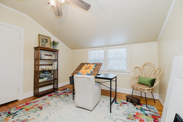 home office with baseboards, wood finished floors, crown molding, and vaulted ceiling