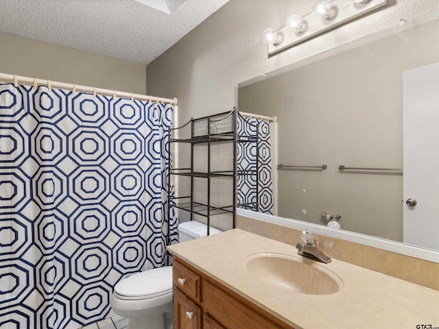 bathroom featuring curtained shower, vanity, a textured ceiling, and toilet